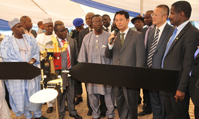 Chinese ambassador to Nigeria Deng Boqing (5th R) speaks in front of a satellite model in capital of Abuja Photo: capitalfm.ko.ke